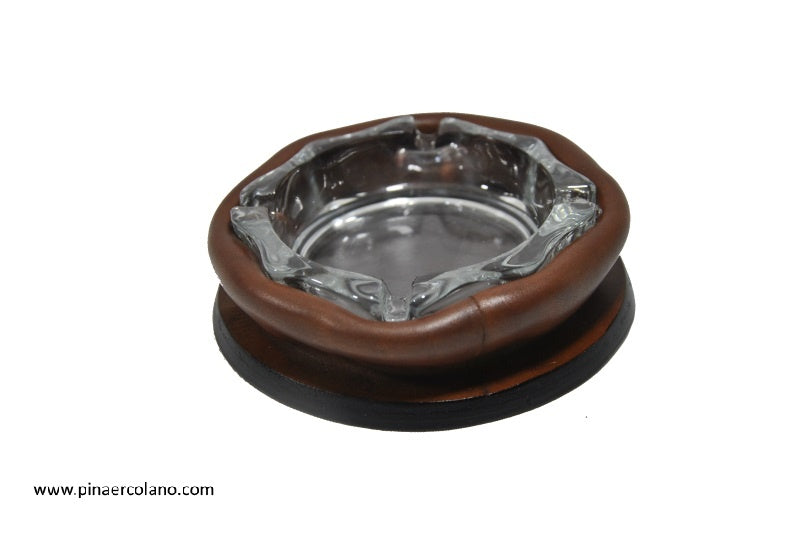 Posacenere rotondo di cristallo con base supporto in cuoio massello ondulato